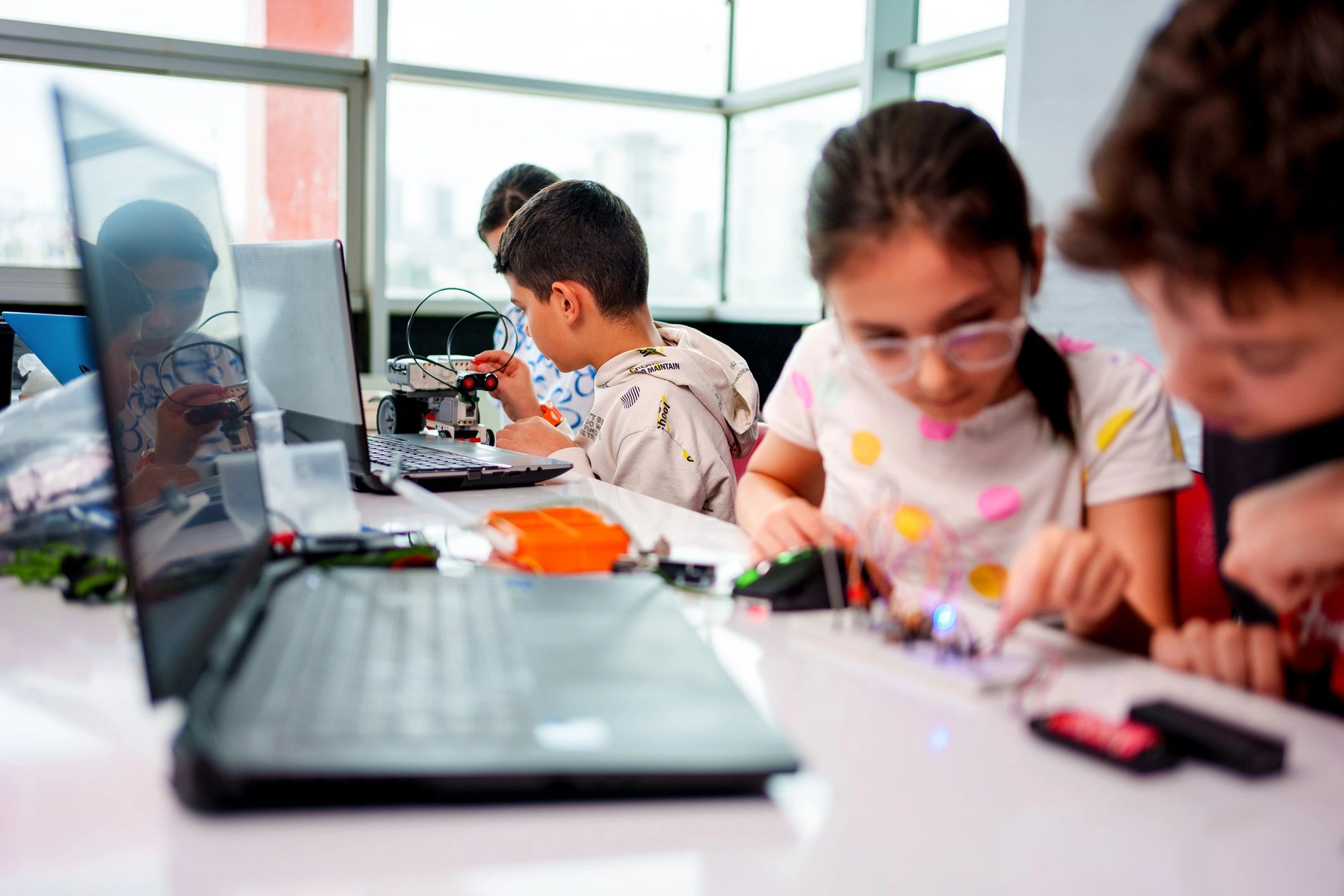 Students collaborating during a robotics and STEM education workshop